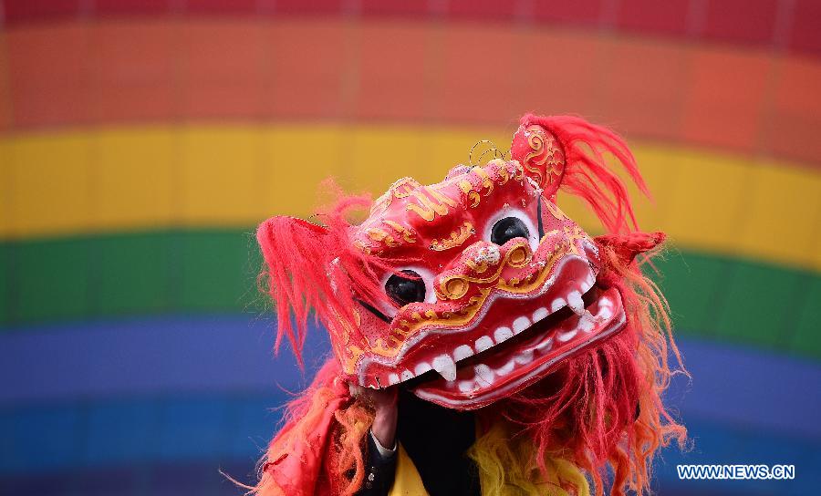 Performers play lion dance during a celebration for "Er Yue Er" in Tu Autonomous County of Huzhu, northwest China's Qinghai Province, March 13, 2013, on the occasion of the second day of the second lunar month, known in Chinese as Er Yue Er, "a time for the dragon to raise its head", as a Chinese saying goes. Local residents gathered together and celebrated the festival with traditional performance. (Xinhua/Zhang Hongxiang)  