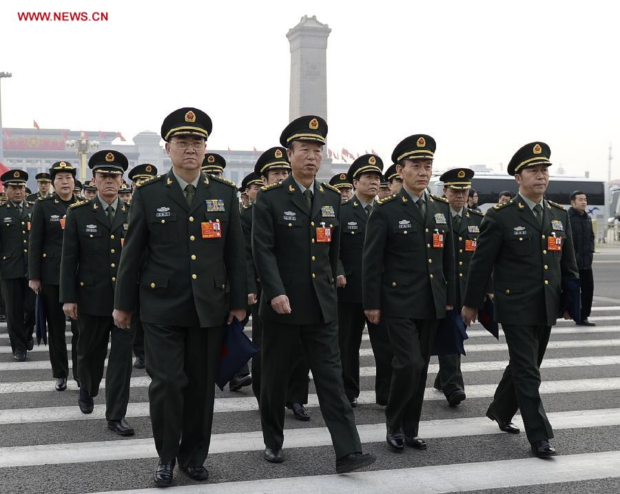 Deputies to the 12th National People's Congress (NPC) from the People's Liberation Army (PLA) walk to the Great Hall of the People in Beijing, capital of China, March 14, 2013. The fourth plenary meeting of the first session of the 12th NPC is to be held in Beijing on Thursday, at which Chairman, vice-chairpersons, secretary-general and members of the 12th NPC Standing Committee, president and vice-president of the state, and chairman of the Central Military Commission of the People's Republic of China will be elected. (Xinhua/Wang Peng) 