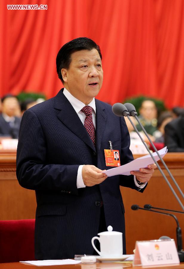 Liu Yunshan presides over the fourth plenary meeting of the first session of the 12th National People's Congress (NPC) at the Great Hall of the People in Beijing, capital of China, March 14, 2013. Chairman, vice-chairpersons, secretary-general and members of the 12th NPC Standing Committee, president and vice-president of the state, and chairman of the Central Military Commission of the People's Republic of China will be elected here on Thursday. (Xinhua/Lan Hongguang)
