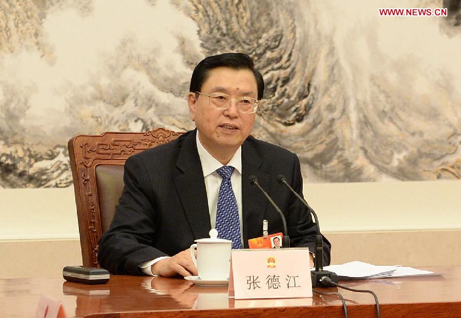 Zhang Dejiang, executive chairperson of the presidium of the first session of the 12th National People's Congress (NPC), presides over the fourth meeting of the presidium's executive chairpersons at the Great Hall of the People in Beijing, capital of China, March 13, 2013. (Xinhua/Ma Zhancheng)