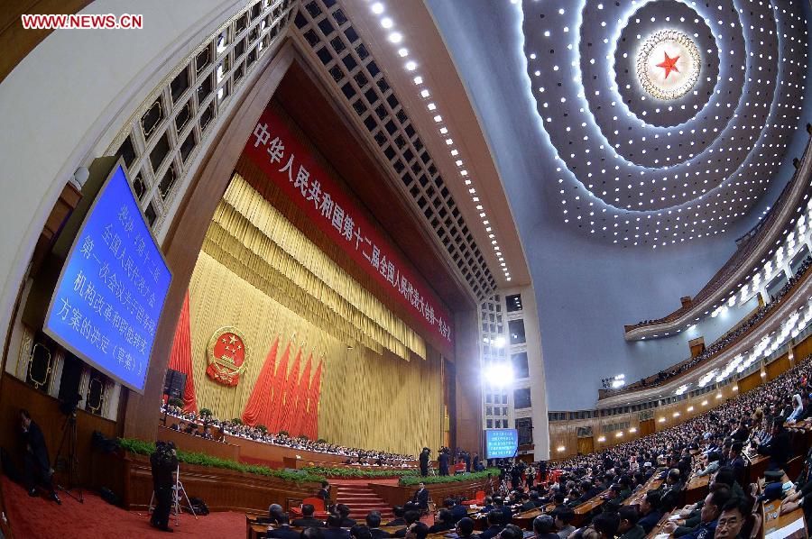 The fourth plenary meeting of the first session of the 12th National People's Congress (NPC) is held at the Great Hall of the People in Beijing, capital of China, March 14, 2013. Chairman, vice-chairpersons, secretary-general and members of the 12th NPC Standing Committee, president and vice-president of the state, and chairman of the Central Military Commission of the People's Republic of China will be elected here on Thursday. (Xinhua/Li Tao)