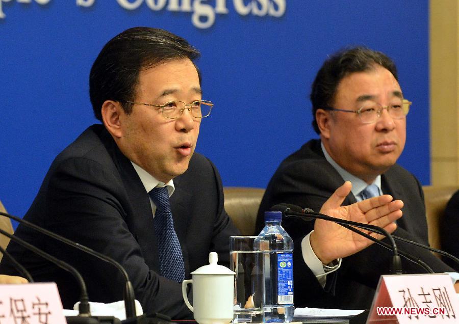 Sun Zhigang (L), director of the health reform office of the State Council, speaks at a press conference on medical and healthcare system reform held by the first session of the 12th National People's Congress (NPC) in Beijing, capital of China, March 14, 2013. (Xinhua/Wang Song)