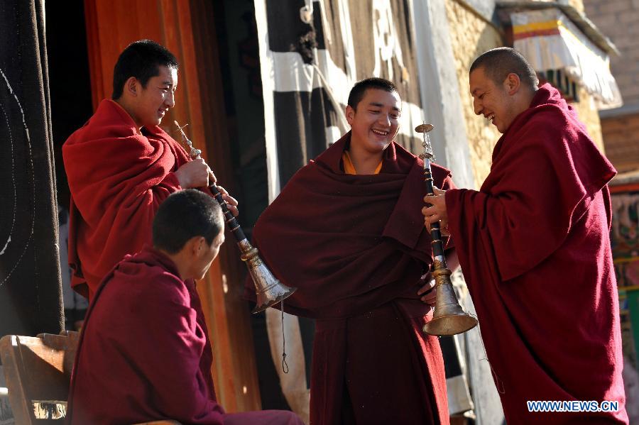 Buddhist monks practise religious musical instruments at the Ganden Stumtseling Monastery, the largest Tibetan Buddhism temple in Yunnan Province, in Shangri-la County, southwest China's Yunnan Province, March 14, 2013. (Xinhua/Lin Yiguang) 