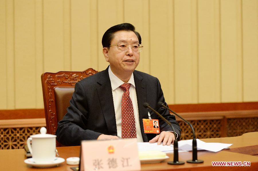 Zhang Dejiang, executive chairperson of the presidium of the first session of the 12th National People's Congress (NPC), presides over the fifth meeting of the presidium at the Great Hall of the People in Beijing, capital of China, March 14, 2013. (Xinhua/Ma Zhancheng)