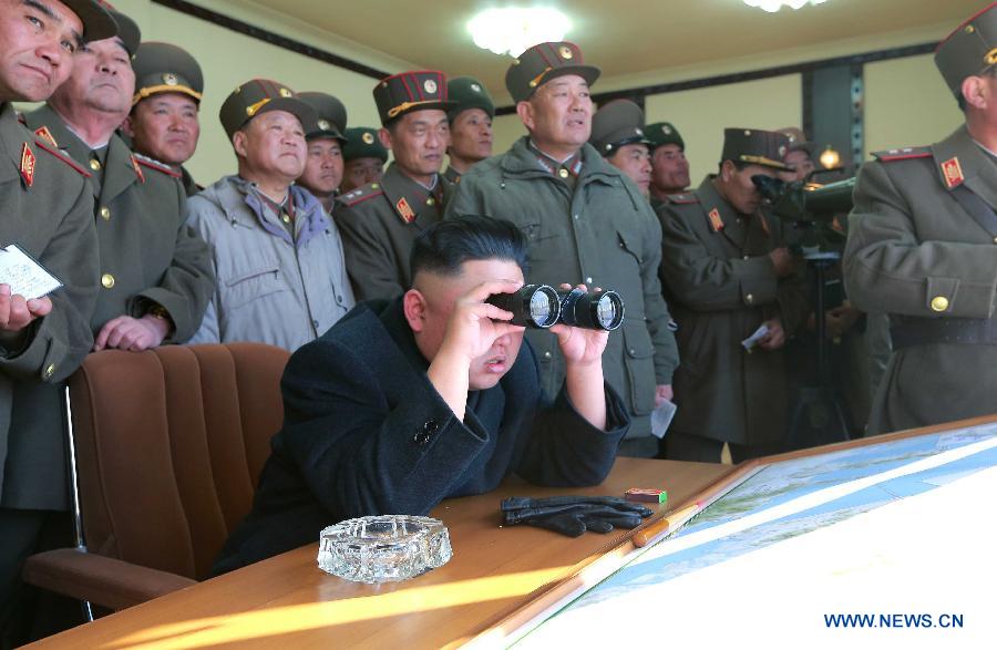 The undated photo provided by Korean Central News Agency (KCNA) on March 14, 2013 shows Kim Jong Un, top leader of the Democratic People's Republic of Korea (DPRK), watching a live shell firing drill at the southwest sector of the front line. Kim Jong Un watched and guided the drill which was conducted by the Jangjae Islet defense detachment and the Mu Islet artillery detachment. (Xinhua/KCNA) 