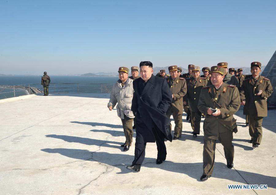 The undated photo provided by Korean Central News Agency (KCNA) on March 14, 2013 shows Kim Jong Un, top leader of the Democratic People's Republic of Korea (DPRK), watching a live shell firing drill at the southwest sector of the front line. Kim Jong Un watched and guided the drill which was conducted by the Jangjae Islet defense detachment and the Mu Islet artillery detachment. (Xinhua/KCNA)  