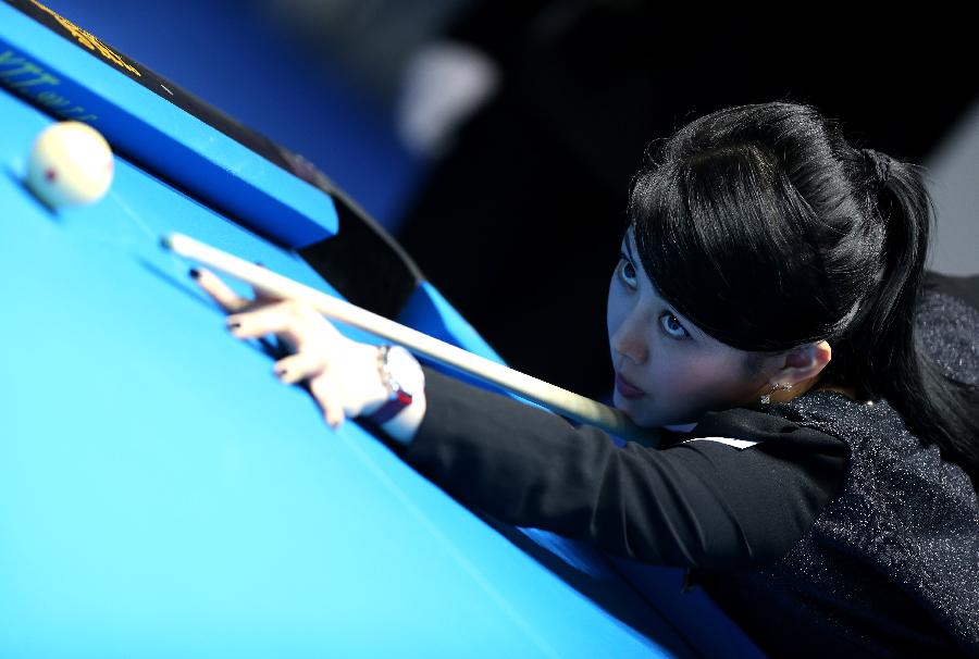Pan Xiaoting of China competes during the first day match against Jennifer Barretta of the United States at the 2013 Amway eSpring Women's World 9-Ball Open in Taipei, southeast China's Taiwan, March 14, 2013. Pan Xiaoting won 7-3. (Xinhua/Xie Xiudong) 