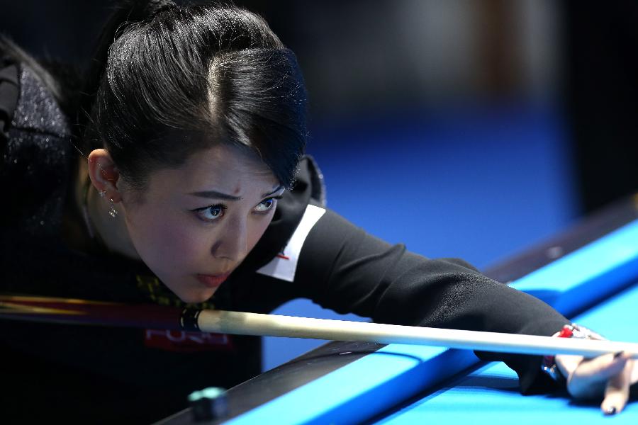Pan Xiaoting of China competes during the first day match against Jennifer Barretta of the United States at the 2013 Amway eSpring Women's World 9-Ball Open in Taipei, southeast China's Taiwan, March 14, 2013. Pan Xiaoting won 7-3. (Xinhua/Xie Xiudong) 