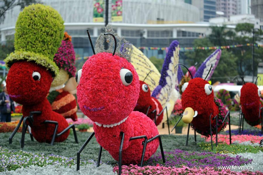 Photo taken on March 14, 2013 shows a parterre themed on insects displayed at a flower show in south China's Hong Kong. The 10-day Hong Kong Flower Show 2013, which will kick off on March 15, 2013 at Victoria Park, opened to media for a preview on Thursday. More than 200 organizations contributed some 350,000 flowers to the show. (Xinhua/Zhao Yusi) 