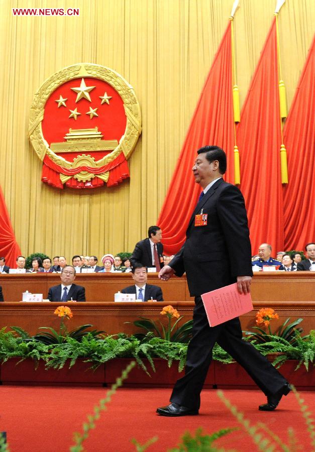 Xi Jinping walks to cast his vote at the fifth plenary meeting of the first session of the 12th National People's Congress (NPC) at the Great Hall of the People in Beijing, capital of China, March 15, 2013. The meeting will vote to decide on the premier, as well as vice chairpersons and members of the Central Military Commission of the People's Republic of China. President of the Supreme People's Court and procurator-general of the Supreme People's Procuratorate will also be elected. (Xinhua/Liu Jiansheng)