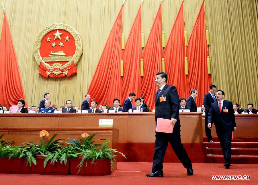 Xi Jinping and Li Keqiang walk to cast their votes at the fifth plenary meeting of the first session of the 12th National People's Congress (NPC) at the Great Hall of the People in Beijing, capital of China, March 15, 2013. The meeting will vote to decide on the premier, as well as vice chairpersons and members of the Central Military Commission of the People's Republic of China. President of the Supreme People's Court and procurator-general of the Supreme People's Procuratorate will also be elected. (Xinhua/Li Tao)