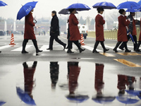Enjoy 1st spring rain in front of the Great Hall of the People
