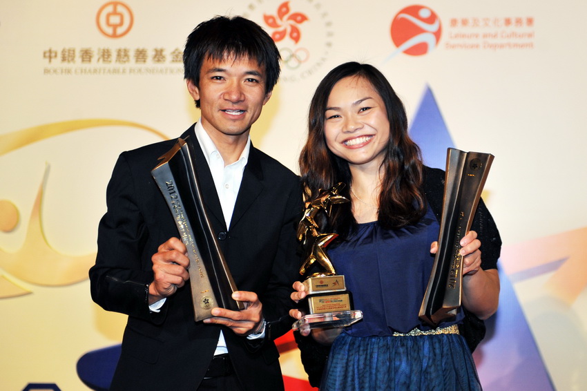 "Best of the Best Hong Kong Sports Stars Award" winner Lee Wai Sze (R) and "Hong Kong Sportsmanship Sports Stars Award" winner Wong Kam po pose for a group photo at the Hong Kong Convention and Exhibition Centre on March 14, 2013. (Xinhua/Lu Binghui)