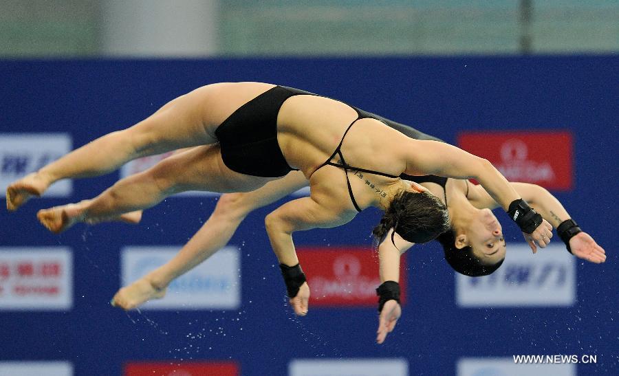 Meaghan Benfeito and Roseline Filion of Canada compete during the women's 10m Platform Synchro Final in the FINA Diving World Series 2013-Beijing at the National Aquatics Center in Beijing, China, Match 15, 2013. Meaghan Benfeito and Roseline Filion won the silver medal with 316.71 points. (Xinhua/Jia Yuchen)