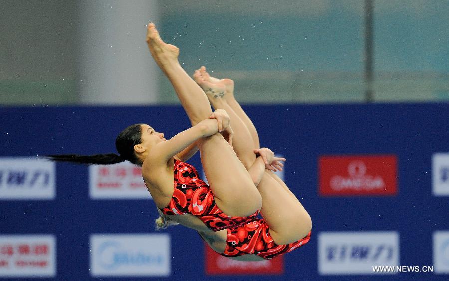 Yulia Koltunova and Natalia Goncharova of Russia compete during the Women's 10m Platform Synchro Final in the FINA Diving World Series 2011-Beijing at National Aquatics Center in Beijing, China, March 15, 2013. Yulia Koltunova and Natalia Goncharova won the bronze medal with 316.56 points. (Xinhua/Cao Can