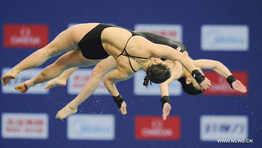 Meaghan Benfeito and Roseline Filion of Canada compete during the Women's 10m Platform Synchro Final in the FINA Diving World Series 2011-Beijing at National Aquatics Center in Beijing, China, March 15, 2013. Meaghan Benfeito and Roseline Filion won the silver medal with 316.71 points. (Xinhua/Cao Can)