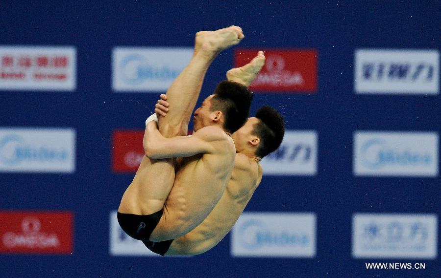 Lin Yue and Chen Aisen of China compete during the Men's 10m Platform Synchro Final in the FINA Diving World Series 2013-Beijing at the National Aquatics Center in Beijing, China, Match 15, 2013. Lin and Chen won the gold medal with 493.47 points. (Xinhua/Cao Can)