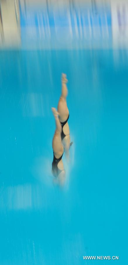 Meaghan Benfeito and Roseline Filion of Canada compete during the women's 10m Platform Synchro Final in the FINA Diving World Series 2013-Beijing at the National Aquatics Center in Beijing, China, Match 15, 2013. Meaghan Benfeito and Roseline Filion won the silver medal with 316.71 points. (Xinhua/Jia Yuchen)