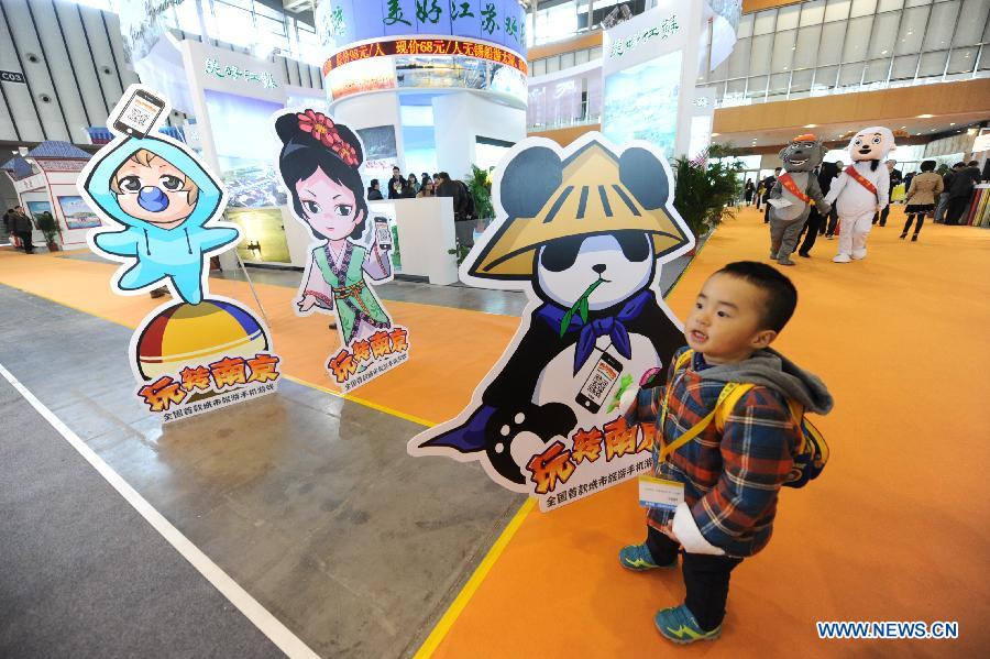 A boy is seen at the 2013 China International Exhibition for Caravanning, Motoring, Tourism (CMT China) in Nanjing, capital of east China's Jiangsu Province, March 15, 2013. The three-day exhibition, with the participation of 289 exhibitors from 28 countries and regions, opened in Nanjing Friday. (Xinhua/Shen Peng) 
