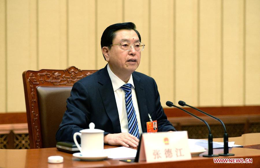 Zhang Dejiang, executive chairperson of the presidium of the first session of the 12th National People's Congress (NPC), presides over the seventh meeting of the presidium at the Great Hall of the People in Beijing, capital of China, March 15, 2013. (Xinhua/Ma Zhancheng)