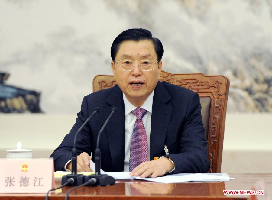 Zhang Dejiang, executive chairperson of the presidium of the first session of the 12th National People's Congress (NPC), presides over the sixth meeting of the presidium's executive chairpersons at the Great Hall of the People in Beijing, capital of China, March 16, 2013. (Xinhua/Ma Zhancheng)