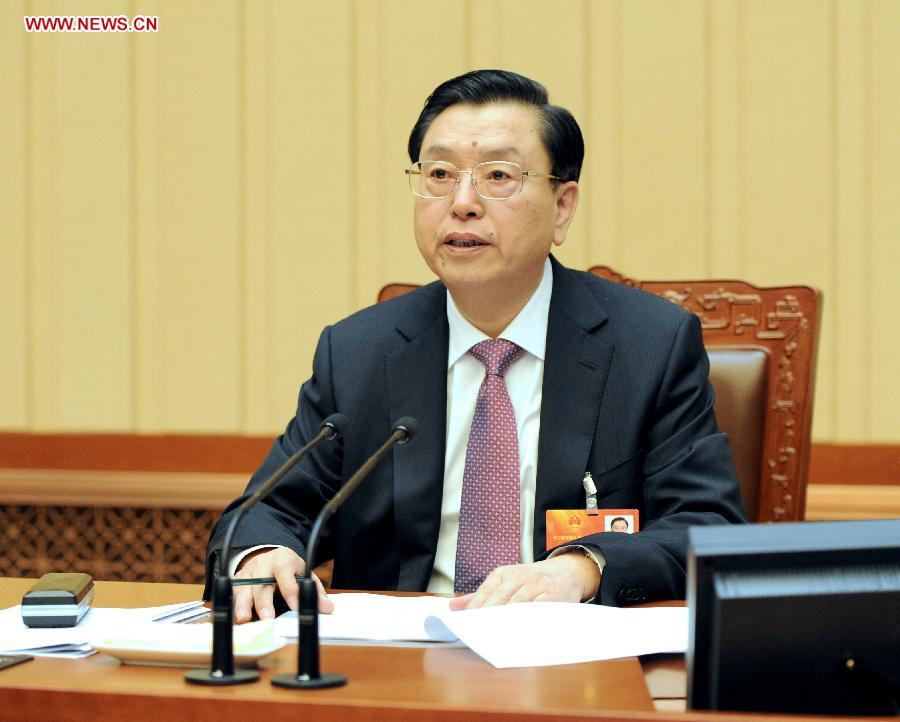 Zhang Dejiang, executive chairperson of the presidium of the first session of the 12th National People's Congress (NPC), presides over the eighth meeting of the presidium at the Great Hall of the People in Beijing, capital of China, March 16, 2013. (Xinhua/Ma Zhancheng)