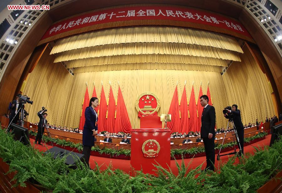 Members of the intendancy stand beside a ballot box during the sixth plenary meeting of the first session of the 12th National People's Congress (NPC) at the Great Hall of the People in Beijing, capital of China, March 16, 2013. (Xinhua/Pang Xinglei) 