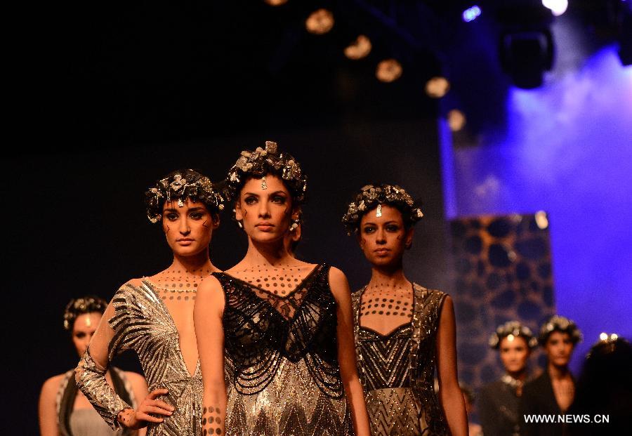 Models display creations by Paras and Shalini during the Wills Lifestyle India Fashion Week in New Delhi, capital of India, on March 16, 2013. (Xinhua/Partha Sarkar)  