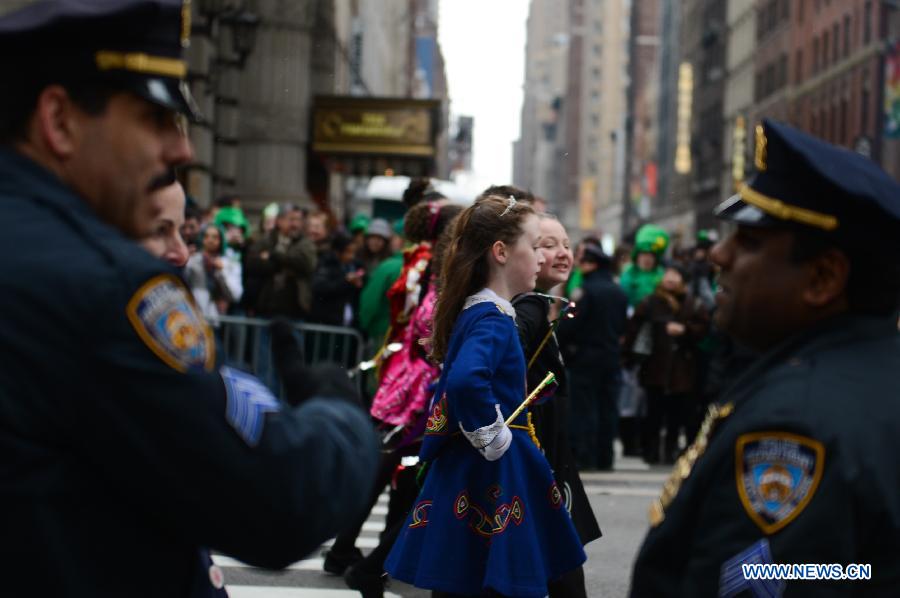 Participants of the 252nd St. Patrick's Day parade march along the Fifth Avenue in New York City, on March 16, 2013. St. Patrick's Day is widely observed in the United States as a celebration of the Irish and Irish American culture. (Xinhua/Niu Xiaolei) 