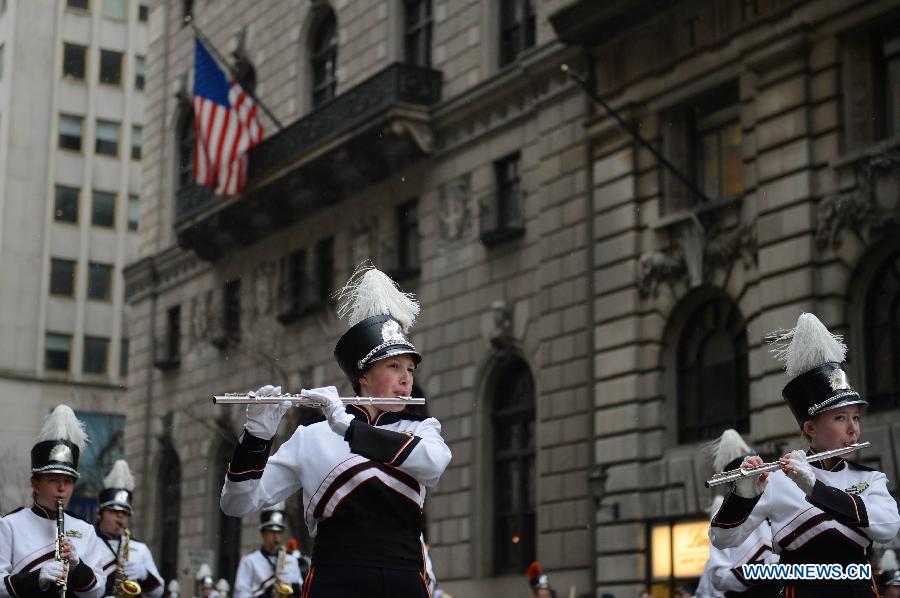 Participants of the 252nd St. Patrick's Day parade march along the Fifth Avenue in New York City, on March 16, 2013. St. Patrick's Day is widely observed in the United States as a celebration of the Irish and Irish American culture. (Xinhua/Niu Xiaolei) 