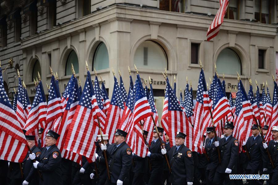 Participants of the 252nd St. Patrick's Day parade march along the Fifth Avenue in New York City, on March 16, 2013. St. Patrick's Day is widely observed in the United States as a celebration of the Irish and Irish American culture. (Xinhua/Niu Xiaolei) 