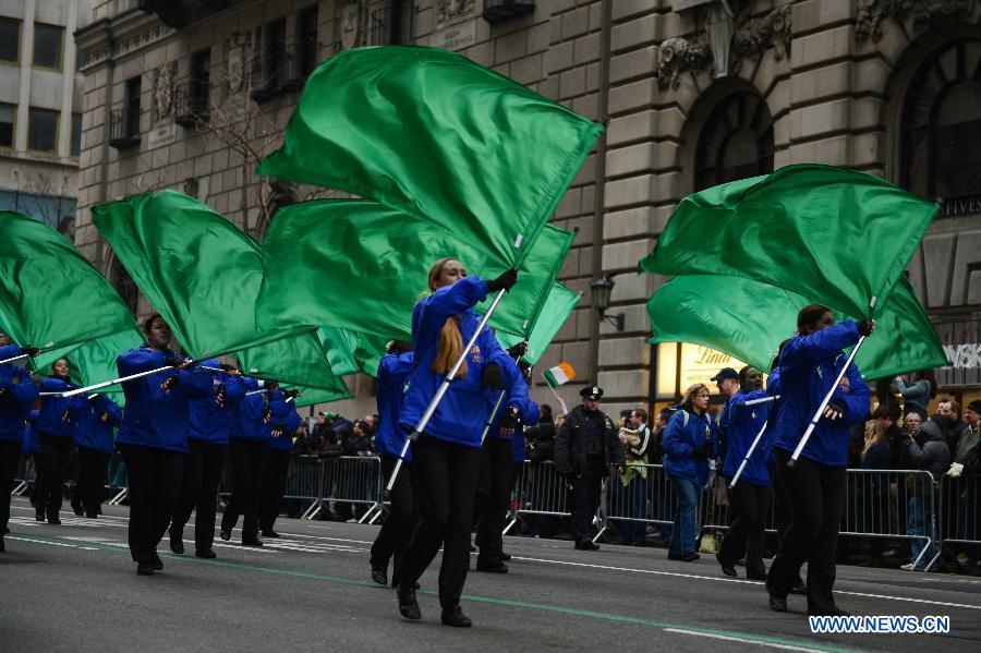 Participants of the 252nd St. Patrick's Day parade march along the Fifth Avenue in New York City, on March 16, 2013. St. Patrick's Day is widely observed in the United States as a celebration of the Irish and Irish American culture. (Xinhua/Niu Xiaolei) 