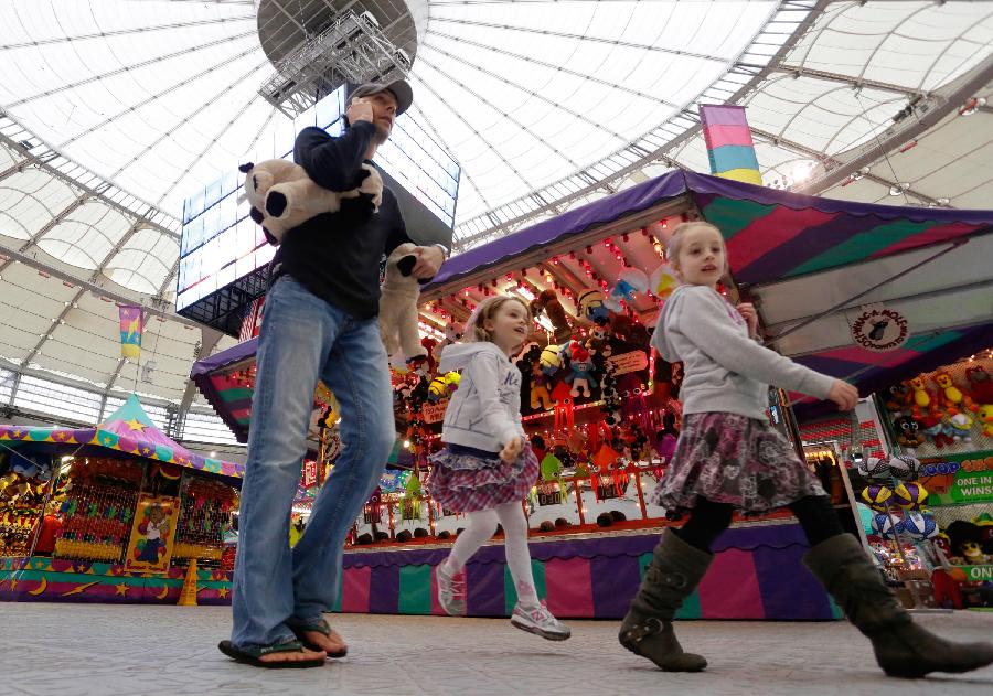 People enjoy their day at the Playdome carnival held at BC Place stadium in Vancouver, Canada. March 16, 2013. (Xinhua/Liang Sen) 