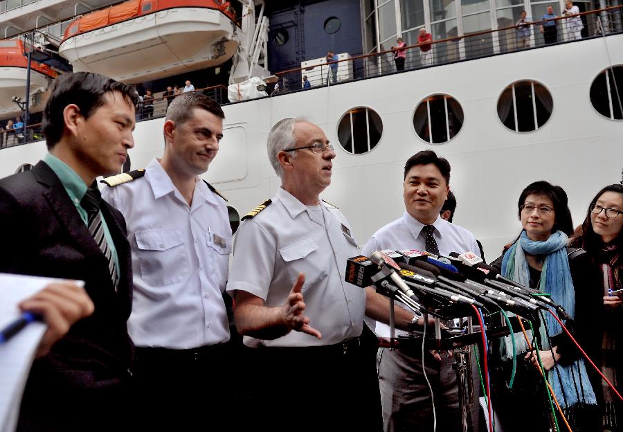 The captain of the cruise ship GTS Millennium (3rd L) is interviewed at the Kai Tak Cruise Terminal in south China's Hong Kong, March 16, 2013. GTS Millennium arrived at Hong Kong's Kai Tak Cruise Terminal on Saturday and became the first cruise ship to berth at the terminal prior to its official opening in June 2013. (Xinhua/Chen Xiaowei) 