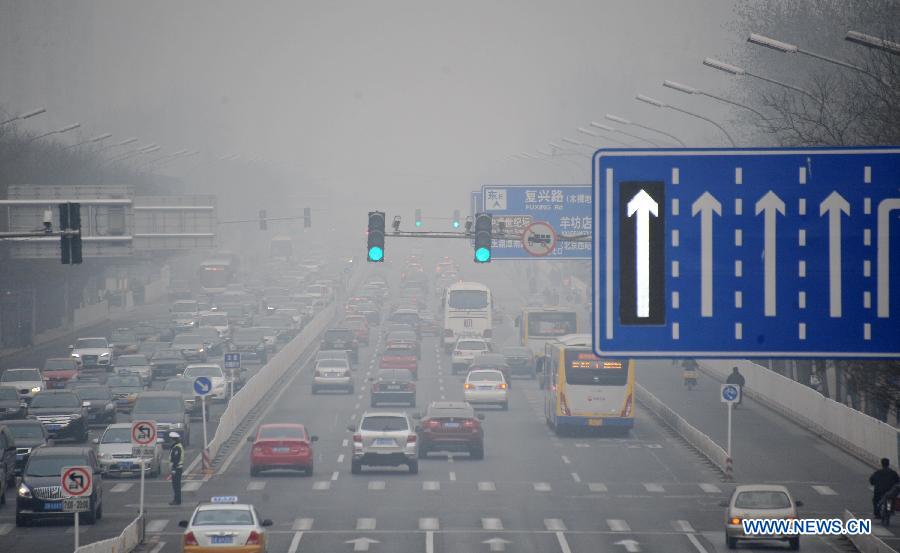 Vehicles run on a fog-shrouded road in Beijing, capital of China, March 17, 2013. Fog and smog blanketed Beijing on Sunday. (Xinhua/Li Xin)  