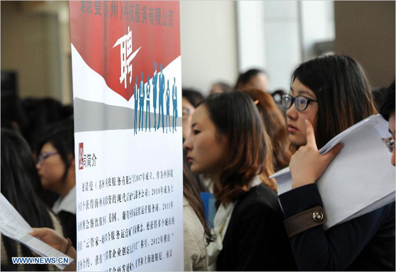College students are seen during a job fair specially held for females in Nanjing, capital of east China's Jiangsu Province, March 9, 2013. A job fair for female college students were held here on Saturday, providing more than 3,000 positions from some 100 employers. (Photo/ Xinhua) 