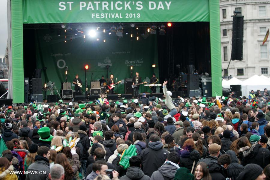 People attend the celebration of St. Patrick's Day at Trafalgar Square in London, March 17, 2013. (Xinhua/Bimal Gautam) 
