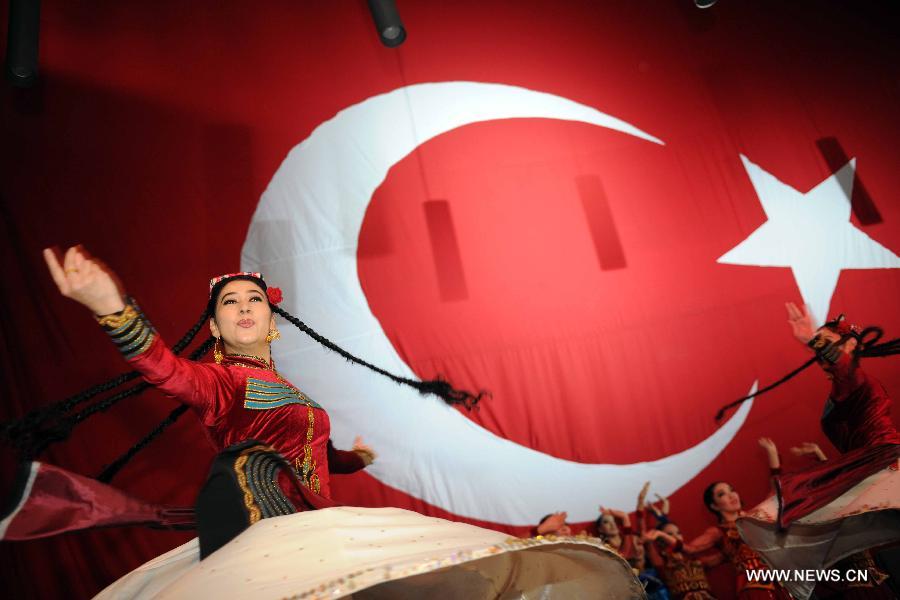 Artists perform on stage at Nevruz celebrations in Istanbul, Turkey, on March 17, 2013. The Nevruz performance, organized by the Joint Administration of Turkic Arts and Culture (TURKSOY), brings together more than 250 artists from different countries or regions to celebrate Nevruz in 15 cities of Turkey. (Xinhua/Ma Yan)