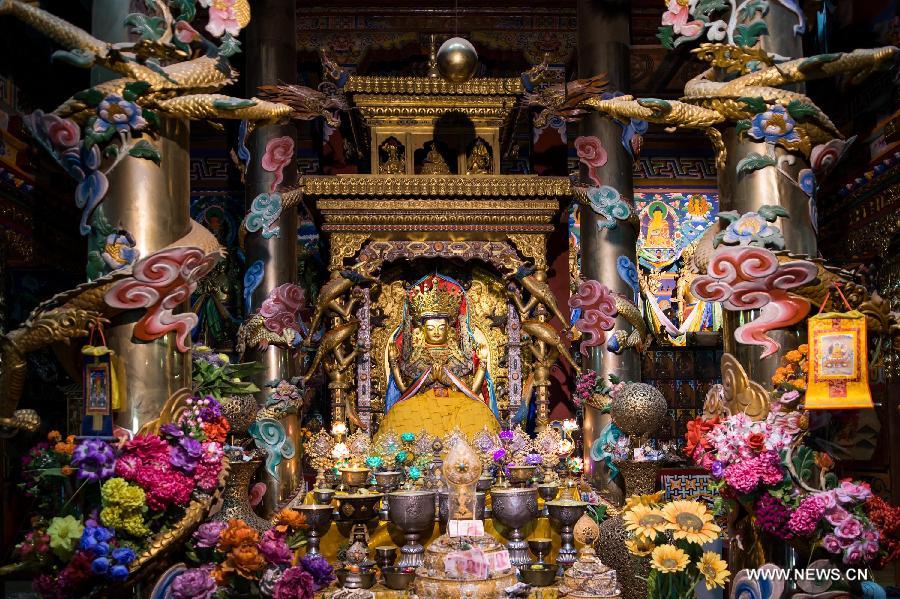 Photo taken on March 17, 2013 shows the statue of the Four-Armed Avalokitesvara at the Guanyin Temple in Jinchuan County, Aba Tibetan Autonomous Region, southwest China's Sichuan Province. The temple was first build in the seventh century and hosts the shrine to the Four-Armed Avalokitesvara boddhisattva. (Xinhua/Jiang Hongjing)