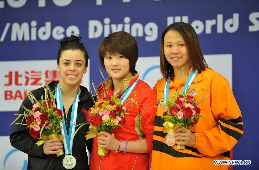 Gold medalist Chen Ruolin (C) of China is seen on the podium during the awarding ceremony for the Women's 10m platform final at the FINA Diving World Series 2013 held at the Aquatics Center in Beijing, capital of China, on March 17, 2013. Chen Ruolin claimed the title with 403.75 points. (Xinhua/He Changshan)