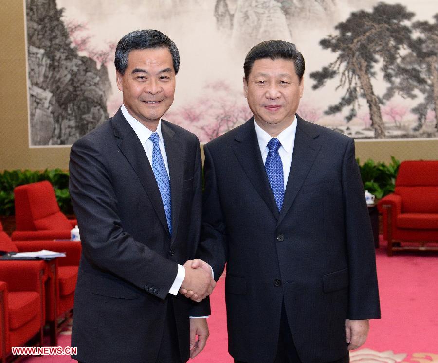 Chinese President Xi Jinping (R) meets with CY Leung, chief executive of Hong Kong Special Administrative Region, in Beijing, capital of China, March 18, 2013. (Xinhua/Liu Jiansheng)  