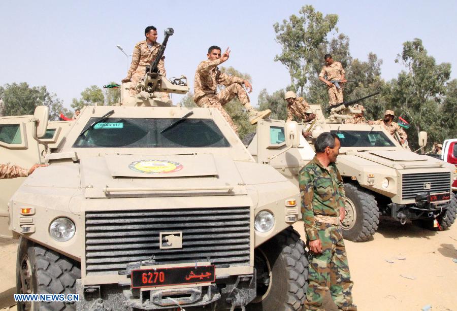 Joint Libyan forces are seen in an illegal militias base in the Libyan capital Tripoli on March 18, 2013. Joint Libyan forces from the ministries of defence and interior expelled two bases of illegal militias in the Libyan capital Tripoli. (Xinhua/Hamza Turkia)