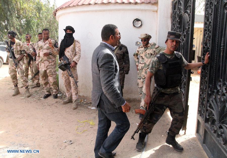 Joint Libyan forces are seen in an illegal militias base in the Libyan capital Tripoli on March 18, 2013. Joint Libyan forces from the ministries of defence and interior expelled two bases of illegal militias in the Libyan capital Tripoli. (Xinhua/Hamza Turkia)