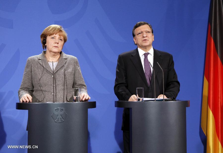 European Union Commission President Jose Manuel Barroso (R) speaks as German Chancellor Angela Merkel listens during a joint press conference prior to the European Round Table of Industrialists, at the Chancellery in Berlin, Germany, March 18, 2013. The leaders of Germany, France and the European Union Commission pledged to boost growth and competitiveness of the European economy at a meeting on Monday in the German capital. (Xinhua/Pan Xu)