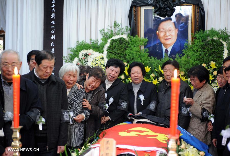 Villagers express condolence to the death of Wu Renbao, the retired Communist Party of China (CPC) chief of Huaxi Village, at the mourning hall in Huaxi Village of Jiangyin City, east China's Jiangsu Province, March 19, 2013. Wu, 85, died of cancer on Monday at his home in the village, which is one of the richest villages in the country. Renowned as China's most eminent farmer, Wu worked hard over the past decades to lead his villagers in striving for common wealth, an ideal regarded as one of the core principles of socialism. (Xinhua/Sun Can)  