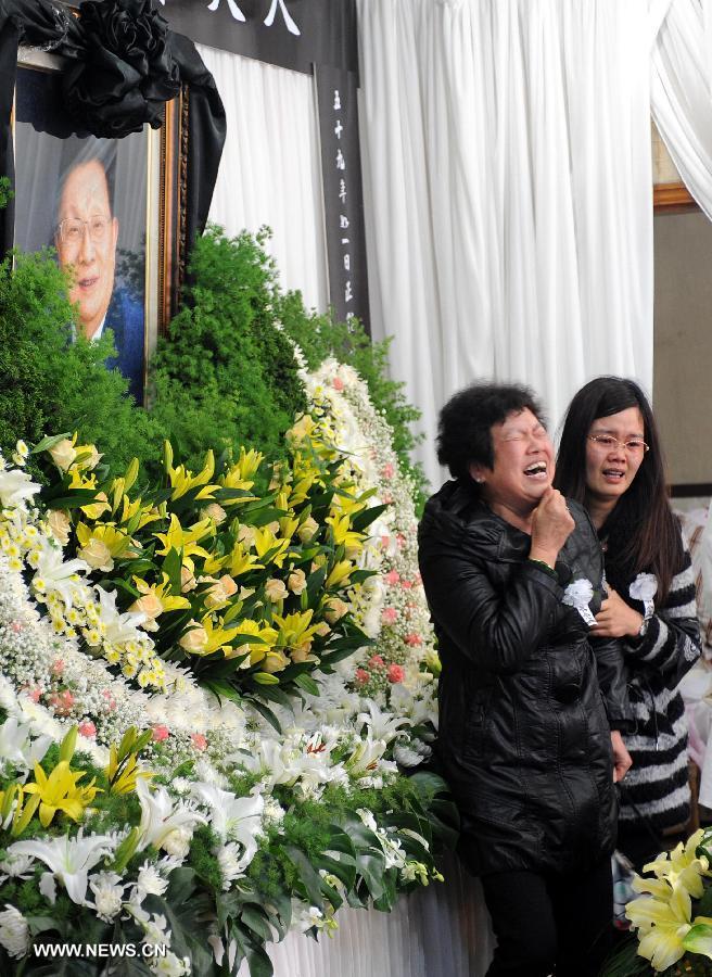 Villagers express condolence to the death of Wu Renbao, the retired Communist Party of China (CPC) chief of Huaxi Village, at the mourning hall in Huaxi Village of Jiangyin City, east China's Jiangsu Province, March 19, 2013. Wu, 85, died of cancer on Monday at his home in the village, which is one of the richest villages in the country. Renowned as China's most eminent farmer, Wu worked hard over the past decades to lead his villagers in striving for common wealth, an ideal regarded as one of the core principles of socialism. (Xinhua/Sun Can) 