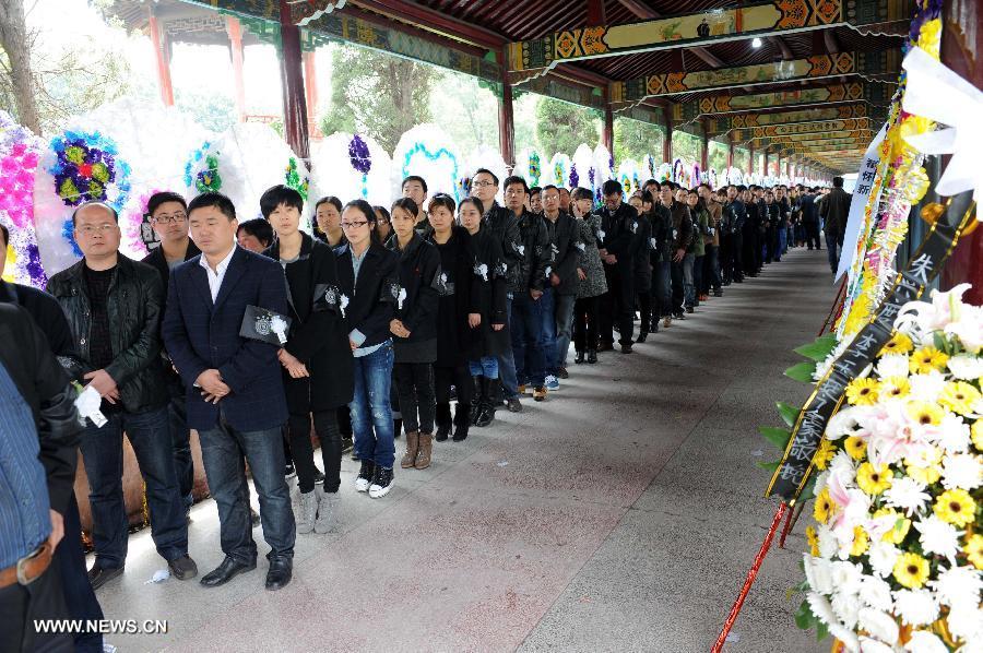 Villagers, employees of village-run enterprises queue up to express condolence to the death of Wu Renbao, the retired Communist Party of China (CPC) chief of Huaxi Village, outside the mourning hall in Huaxi Village of Jiangyin City, east China's Jiangsu Province, March 19, 2013. Wu, 85, died of cancer on Monday at his home in the village, which is one of the richest villages in the country. Renowned as China's most eminent farmer, Wu worked hard over the past decades to lead his villagers in striving for common wealth, an ideal regarded as one of the core principles of socialism. (Xinhua/Sun Can) 