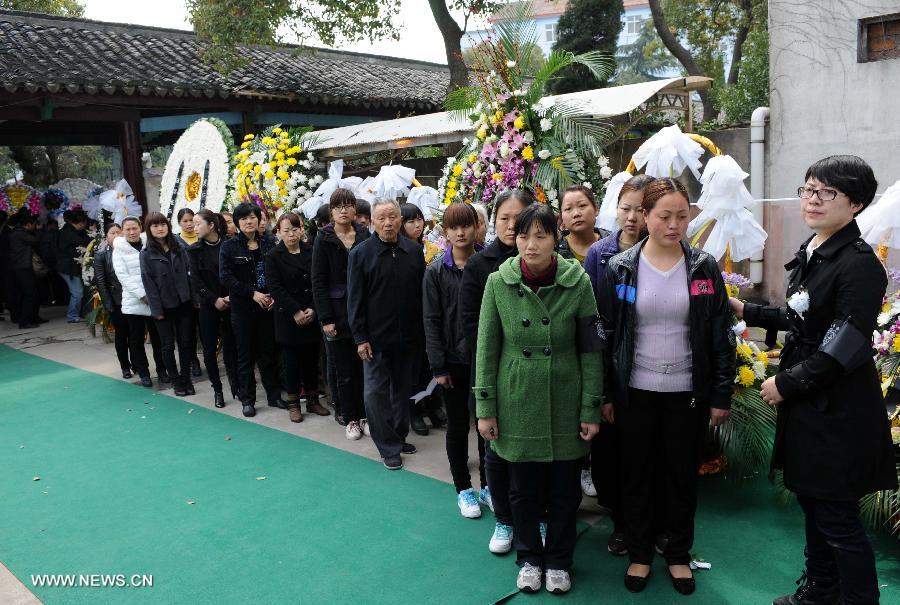 Villagers, employees of village-run enterprises and representatives of all circles queue up to express condolence to the death of Wu Renbao, the retired Communist Party of China (CPC) chief of Huaxi Village, outside the mourning hall in Huaxi Village of Jiangyin City, east China's Jiangsu Province, March 19, 2013. Wu, 85, died of cancer on Monday at his home in the village, which is one of the richest villages in the country. Renowned as China's most eminent farmer, Wu worked hard over the past decades to lead his villagers in striving for common wealth, an ideal regarded as one of the core principles of socialism. (Xinhua/Sun Can) 
