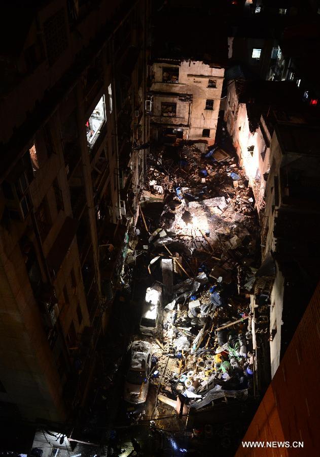 Photo taken on March 19, 2013 shows the blast locale of a residential building in Wuhan, capital of central China's Hubei Province. An explosion ripped through a residential building in Wuhan Tuesday night. Casualties from the blast that broke out at around 10 p.m. in Hanlai Square in the city's Hankou District are still unknown. (Xinhua/Cheng Min)