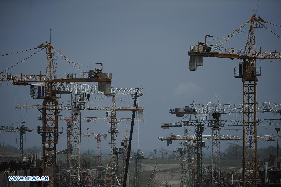 Crane towers stand at the construction site of a new lock for the Panama Canal's widening project in Colon March 19, 2013. The new lock is expected to be completed and operated in April 2015, the project's Director General Bernardo Gonzalez said. (Xinhua/Mauricio Valenzuela)